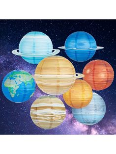 the solar system is made out of paper and hanging from strings with clouds around it