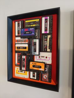 an orange frame with cassette tapes on it