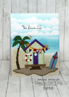 a card with a beach hut and surfboards on it