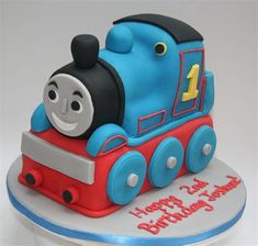 a thomas the train birthday cake on a plate