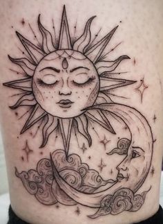 a sun and moon tattoo on the thigh