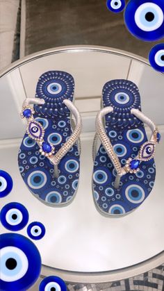 We're a small mother-daughter business crafting unique Havaianas flip flops with love. Each pair is handmade with care, using fine gemstones and materials sourced directly from Brazil. Our goal is to create comfortable yet statement-making sandals perfect for any occasion. The footbed design add a special elegant touch. Customers often comment on the high quality and attention to detail in our work. Whether you're looking for a fun accessory for vacation or something special to gift a loved one, our flip flops are sure to bring joy. We put our hearts into each design, hoping the wearer feels confident and cared for. Please contact us within an hour if you need to modify your order. We're grateful for the opportunity to brighten someone's day with our handiwork.  please take a look at the s Rhinestone Beach Flip Flops, Flat Rhinestone Flip Flops For Beach, Rhinestone Flat Flip Flops For Beach, Handmade Silver Sandals For The Beach, Handmade Blue Sandals For Party, Adjustable Sandals For Beach Season Gift, Silver Round Toe Flip Flops For Vacation, Silver Flat Flip Flops For Beach, Handmade Open Toe Flip Flops As Gift