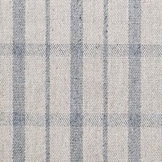 an upholstered checkered fabric pattern in grey and white