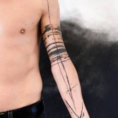 a man with a cross tattoo on his arm