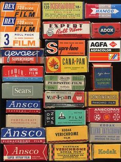 many different types of matchboxes stacked on top of each other in front of a black background