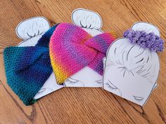 three knitted hats on top of each other