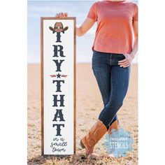 a woman standing next to a sign that says fry hat in a field with cowboy boots