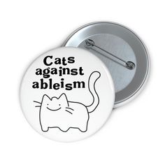 a button with the words cats against ablemm on it