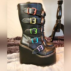 Cute Rainbow/Pride Themed Boots! Rainbow Detail At The Front Of The Boot With Alternating Rainbow Buckles With Rainbow Stictching. 3"-5 1/2"Stitching. Shoes Come With Box. Pretty Comfortable, But Bought Them For An Event I Never Ended Up Going To. Round Toe Platform Boots With Buckle For Alternative Fashion, Edgy Festival Platform Boots With Round Toe, Edgy Platform Boots With Round Toe For Festivals, Edgy Round Toe Platform Boots For Festivals, Alternative Leather Wedge Boots With Round Toe, Alternative Style Leather Wedge Boots With Round Toe, Black Platform Boots For Festival, Leather Wedge Boots With Round Toe For Alternative Fashion, Trendy Black Festival Boots