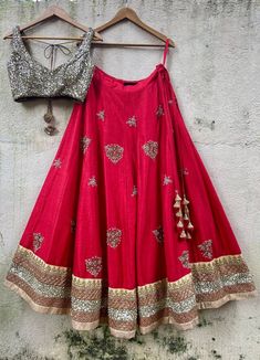 Featuring a Regal Red Raw silk bridal lehenga with sequins pearl and zardozi butti work and a heavy border. Teamed with an antique gold sequinned blouse. The look is complete with ombre tulle dupatta with kundan butti work and pearl work border. Composition: Lehenga and Blouse- Raw Silk, Dupatta - Soft Net All products can be customised for sleeves, length of blouse and neck design Delivery : 2-4 weeks as the product is hand crafted. Check Size Guide or choose MySize for free customisation (All Ombre Dupatta, Silk Bridal Lehenga, Raw Silk Lehenga, Pearl Work, Add Sleeves, Indian Wedding Wear, Silk Lehenga, Silk Dupatta, Sequin Beading