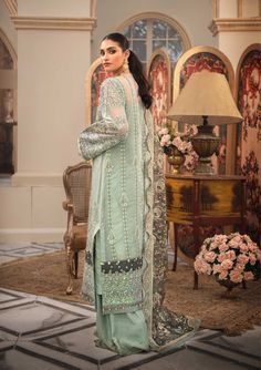 Pakistani Wedding Dress in Sage Green Shade is a stunningly made ensemble with unmatched and exquisite decorations on it rendering it look awe-inspiring and jaw-dropping. This Pakistani Wedding Dress is adorned with luxurious embroidered patterns canvasing the entire dress and turning it into a sight to behold. Kameez: This Pakistani Wedding Dress comes with a beautiful kameez in premium quality organza. This kameez is decorated with fine embroidery work that is even more prominent and holds the Iridescent Design, Raw Silk Pants, Dupatta Border, Embroidered Patterns, Fine Embroidery, Dress Name, Organza Sleeves, Pakistani Wedding Dress, Pakistani Salwar