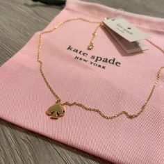 Set- Earrings And Necklace Signature Spade Mini Kate Spade Gold Necklace With Mini Spade Pendant And Matching Earrings. Spade Pendant Is Solid With Crisp Edges On One Side Of The Spade, Curved Soft Edges On Other Side Of Spade. New With Tag, Purchased From Kate Spade To Give As A Gift And Item Was Wrong Color, Final Sale So I Could Not Return. Details: -Pave Bow Bangle Bracelet -Rhodium Plated/Crystal -Inside Engraved Signature -Hinged Closure -2.5" Diameter -Dust Bag Included -Plated Metal Earr Kate Spade Bow Bracelet, October Jewelry, White Jewellery, Spade Necklace, Kate Spade Necklace, Star Necklace Silver, Soft Edges, Bow Bracelet, Set Earrings