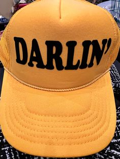 Darlin' Flock Trucker Hat-Caps-Branded Envy Trendy Yellow Baseball Cap Snapback Hat, Trendy Yellow Snapback Hat With Curved Brim, Trendy Yellow Snapback Baseball Cap, Trendy Yellow Hat For Streetwear, Trendy Yellow Snapback Hat, Trendy Yellow Streetwear Hat, Trendy Yellow Trucker Hat With Curved Brim, Retro Letter Print Baseball Cap For Spring, Trendy Yellow Snapback Trucker Hat