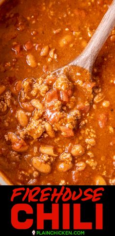 a wooden spoon in a bowl of chili with the words firehouse chili on it