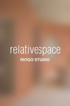 the words relativespace are written in white on a blurry background with an image of a building