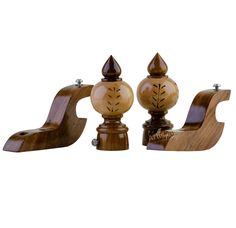 three wooden candlesticks with carved designs on them