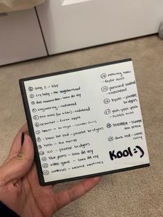 someone is holding up a piece of paper with the words kool written on it