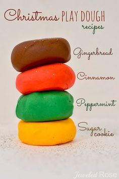 a stack of different colored doughnuts sitting on top of each other with the words christmas play dough