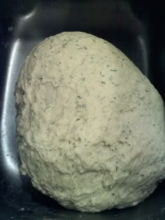 a ball of dough sitting in a bowl