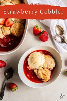 strawberry cobbler in a bowl with ice cream and strawberries on the table next to it