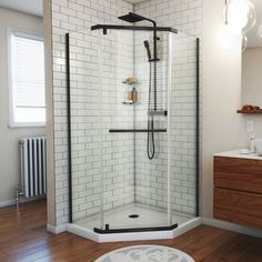 a bathroom with a stand up shower next to a sink