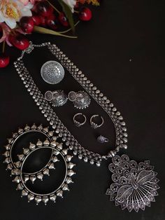 Shop this unique antique looking set handcrafted with love by the experienced craftsmen just for you. you can pair the set with ethnic attire as well as casual to have a statement fusion look. This set of 6 includes Long with pendant, earrings, nose pin, pair of bangle, toe ring and Ring. Premium quality!! Traditional Antique Silver Chandbali Jewelry, Silver Temple Jewelry With Motifs, Traditional Oxidized Jewelry Sets As A Gift, Oxidized Finish Chandbali Jewelry Sets, Oxidized Chandbali Jewelry Sets, Traditional Silver Chandbali Jewelry Sets, Heavy Silver Jewelry Sets For Navratri, Traditional Oxidized Jewelry For Navratri, Silver Oxidized Jewelry Sets For Navratri