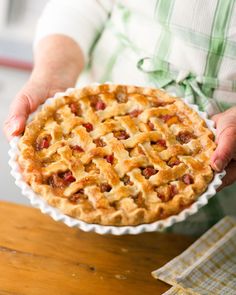 a person holding a pie in their hands