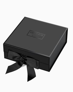 an open black box with a bow on it