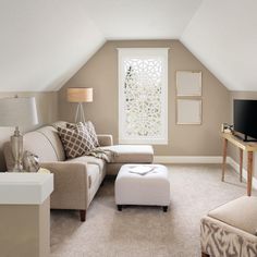 a living room filled with furniture and a flat screen tv