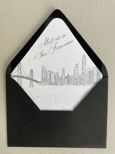 an envelope with the san francisco skyline drawn on it is shown in black and white