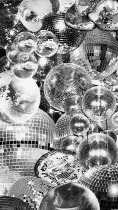 black and white photograph of shiny disco balls