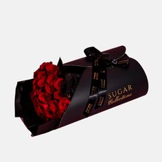 a black box with red roses in it