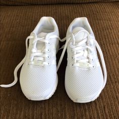 White Adidas Tennis Shoes Size Kids 4.5 Almost Brand New Only Worn A Couple Of Times White Running Shoes With Elastic Laces And Round Toe, White Running Shoes With Elastic Laces, White Low-top Running Shoes For School, Synthetic Lace-up Running Shoes For School, White Cushioned Sneakers For School, Casual White Running Shoes For School, White Lace-up Running Shoes For School, Casual Adidas Running Shoes Non-slip, Adidas Tennis Shoes