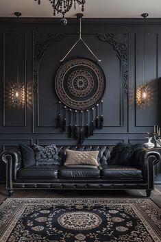 a living room with black leather furniture and chandelier hanging from the ceiling,