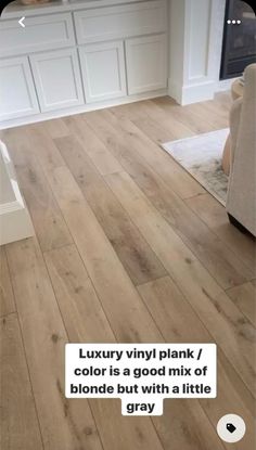 a living room with wood floors and white walls, text reads luxury vinyl plank / color is a good mix of blonde but with a little gray