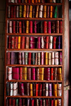 a shelf filled with lots of different colored items