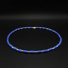 Mens necklace Lapis lazuli blue gemstone, Mens jewelry, Handmade jewelry for men, Blue stone necklace, Unique gifts for men, Gift for him The Gnatus Lapis lazuli beaded necklace has a special cut in shape of tubes. The lapis lazuli stones are matte and have Calcite stripes and Pyrite gold flakes which bring out the full beauty of their color. Every Lapis stone is divided by Hematite silver and light golden roundels and creating a special section effect. Each stone is carefully selected, strung o Lapis Lazuli Blue, Blue Stone Necklace, Mens Necklace, Lapis Lazuli Beads, Unique Gifts For Men, Lapis Lazuli Stone, Jewelry For Men, Necklace Unique, Gold Flakes