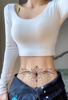 a woman's stomach with a tattoo on the side and an open pocket in front