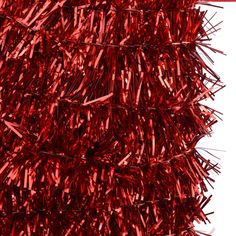 red tinsel hanging from the side of a building