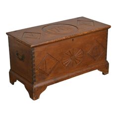 an old wooden chest with carved designs on it