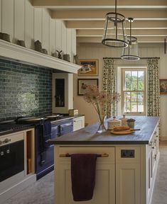 a large kitchen with an island in the middle