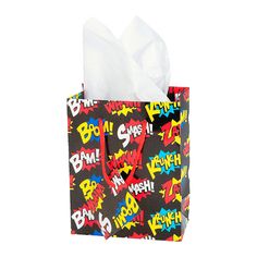 a black bag with comic print on it and tissue paper in the bottom that says bwh