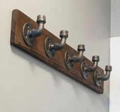 a wooden shelf with metal fittings on it