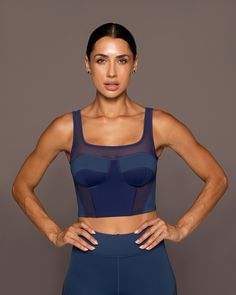 Designer's Notes Boudoir sport bustier with a flattering square neckline, subtle color-blocking panels and mesh inserts for added ventilation. Easy to elevate from day to night. Features Sweat-wicking Eight-way stretch Exceptional breathability Mesh Insert Panels Removable bra cups to provide shape and coverage Made with Love in Canada Size & Fit Tight fit Light support Modelled in size S Model measurements: Height 5'8/170cm, Bust 34(Bra size 32D), Dress 2 Size Guide Fabric & Care 81% Nylon 19% Admiral Blue, Fashion Bra, Fashion Activewear, Facebook Features, Activewear Brands, Fitness Apparel, Activewear Fashion, Women Sports, Wardrobe Ideas