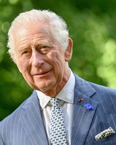 an older man wearing a suit and tie