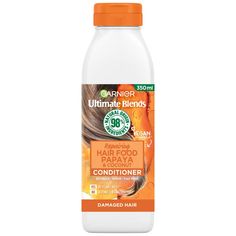 Breathe new life into hair that’s suffering from the effects of over-styling with the Garnier Ultimate Blends Repairing Hair Food Papaya Conditioner For Damaged Hair . Created with damaged locks in mind, the conditioner helps to improve the appearance of broken strands, smoothing your mane for a more lustrous, healthier-looking finish. Formulated to be lightweight, the conditioner nourishes hair deeply without weighing it down or leaving it greasy. Packed with Papaya and Coconut, your hair will be bursting with goodness and feel softer with fewer tangles.  98% natural origin. Suitable for vegans.  Dermatologically tested. Free from silicones. Conditioner For Damaged Hair, Coconut Conditioner, Papaya Fruits, Hair Cleanse, Super Hair, Hair Food, Shea Moisture Products, Moroccan Oil, Nourishing Hair