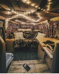 the interior of an rv is decorated with rugs and lights