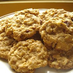 several cookies are stacked on a white plate