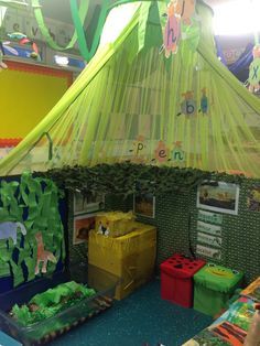 an indoor play area for children to play with inflatable tent and other toys