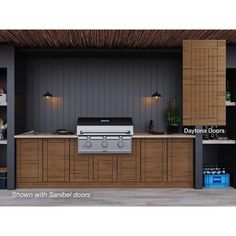 an outdoor kitchen with white cabinets and black walls